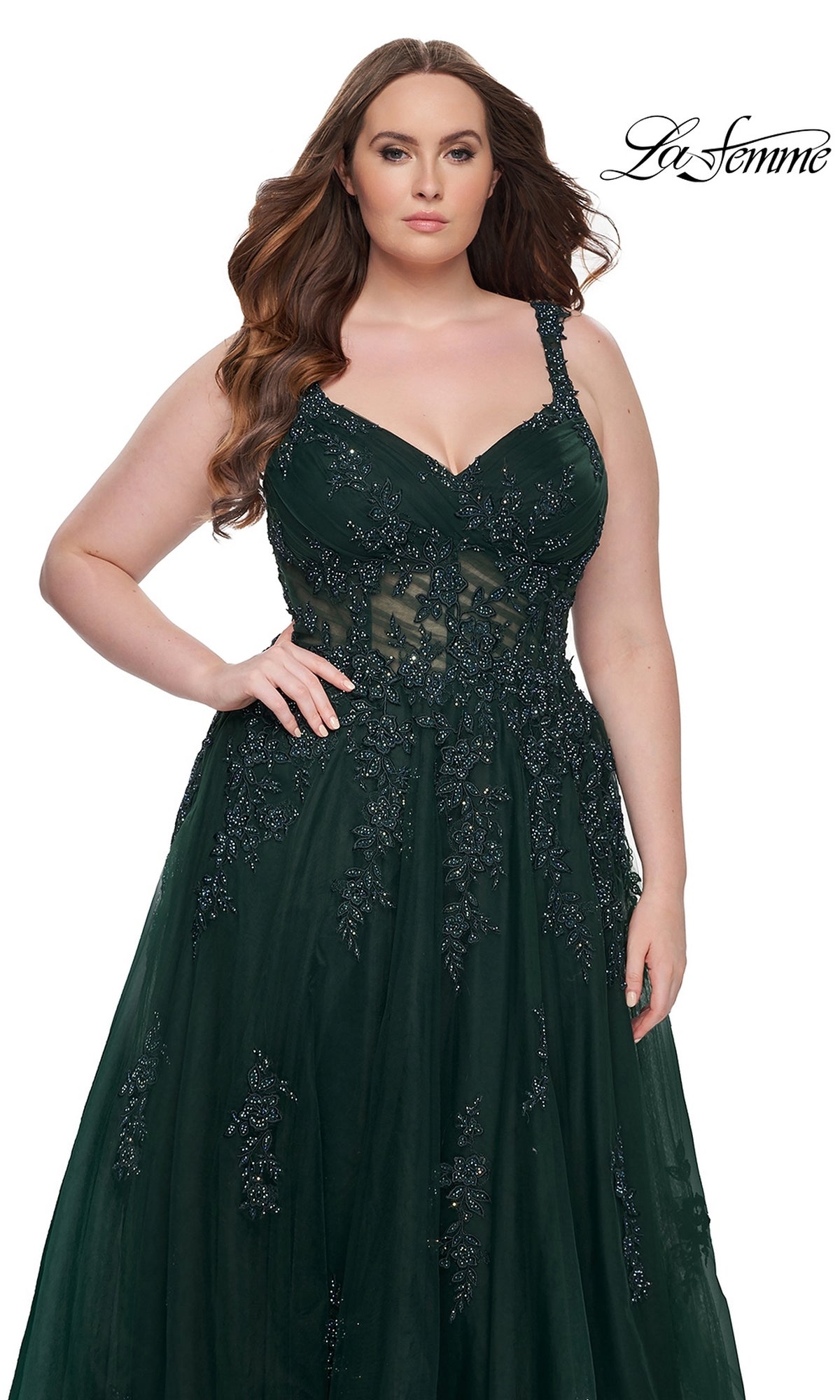 A woman wearing the La Femme Long Prom Dress 31383—dark green, beaded, with a fitted bodice and flowing skirt—poses against a white background.
